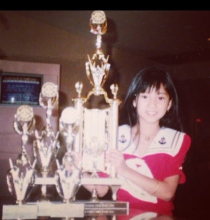 Childhood picture of Roxanne Barcelo and her trophies 